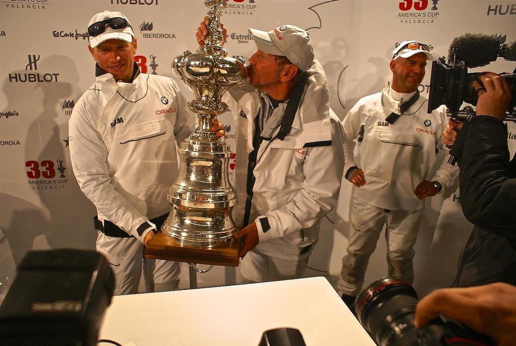 Larry Ellison kisses the America’s Cup at the America’s Cup handover media conference in Valencia in February 2010 © Richard Gladwell www.photosport.co.nz